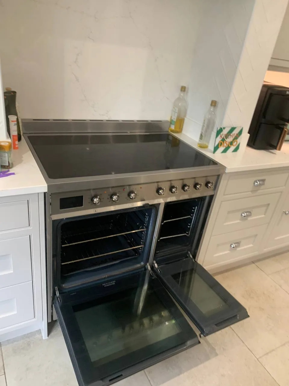 Closer view of the same range cooker with both oven doors open.