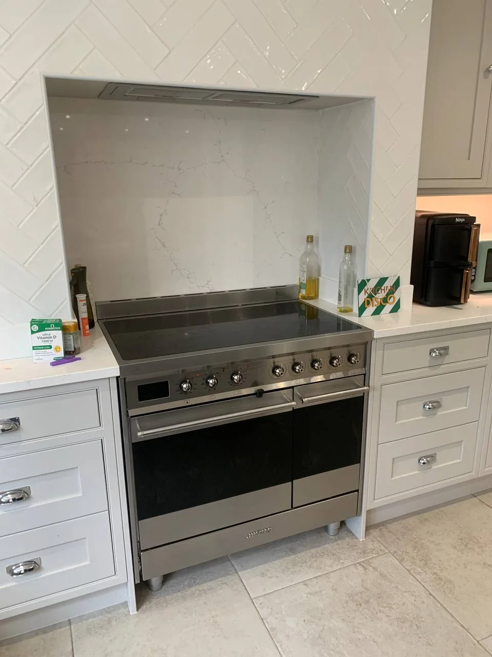 The same range cooker with its doors closed in a white kitchen.