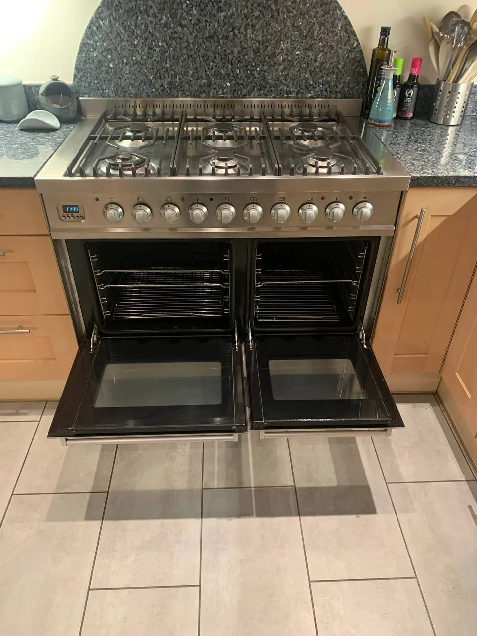 The same range cooker from a higher angle, both oven doors open.