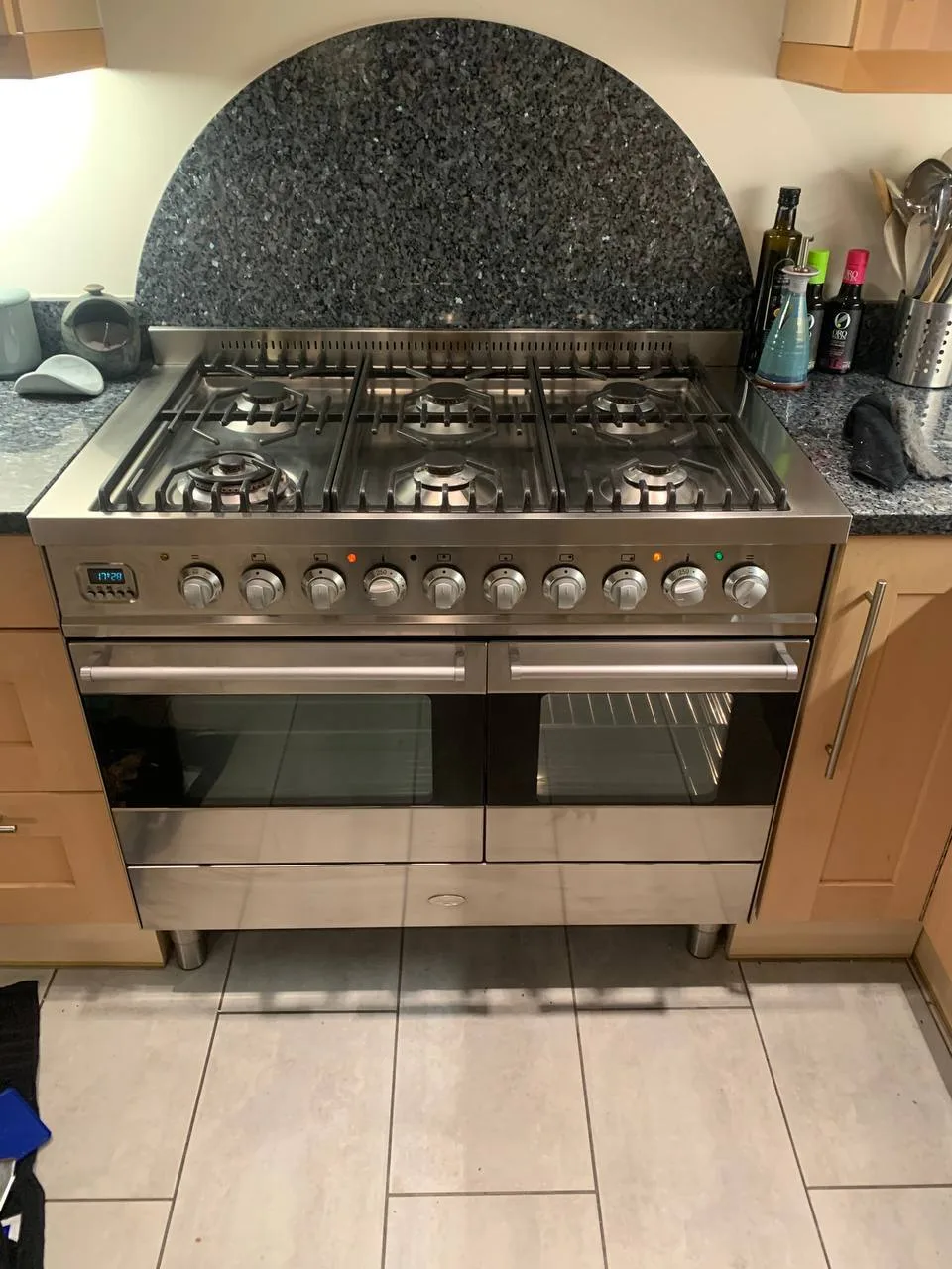 The range cooker with its doors closed, showing the stainless steel front and gas hob.
